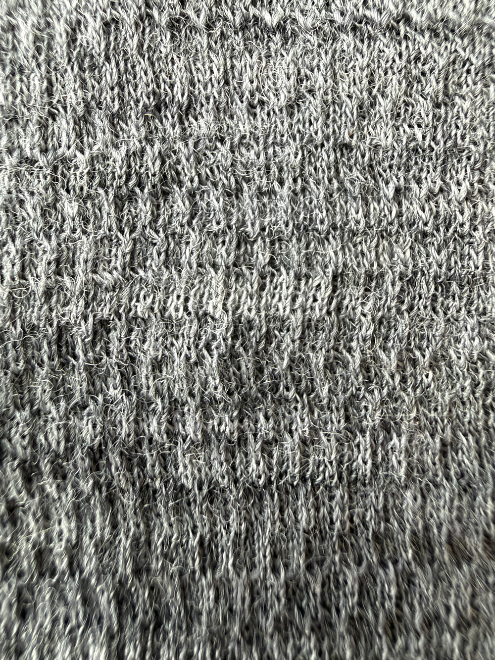 Macro view of the gray Merino mesh fabric used in the Glacial Gear x Zpacks Trail Rag