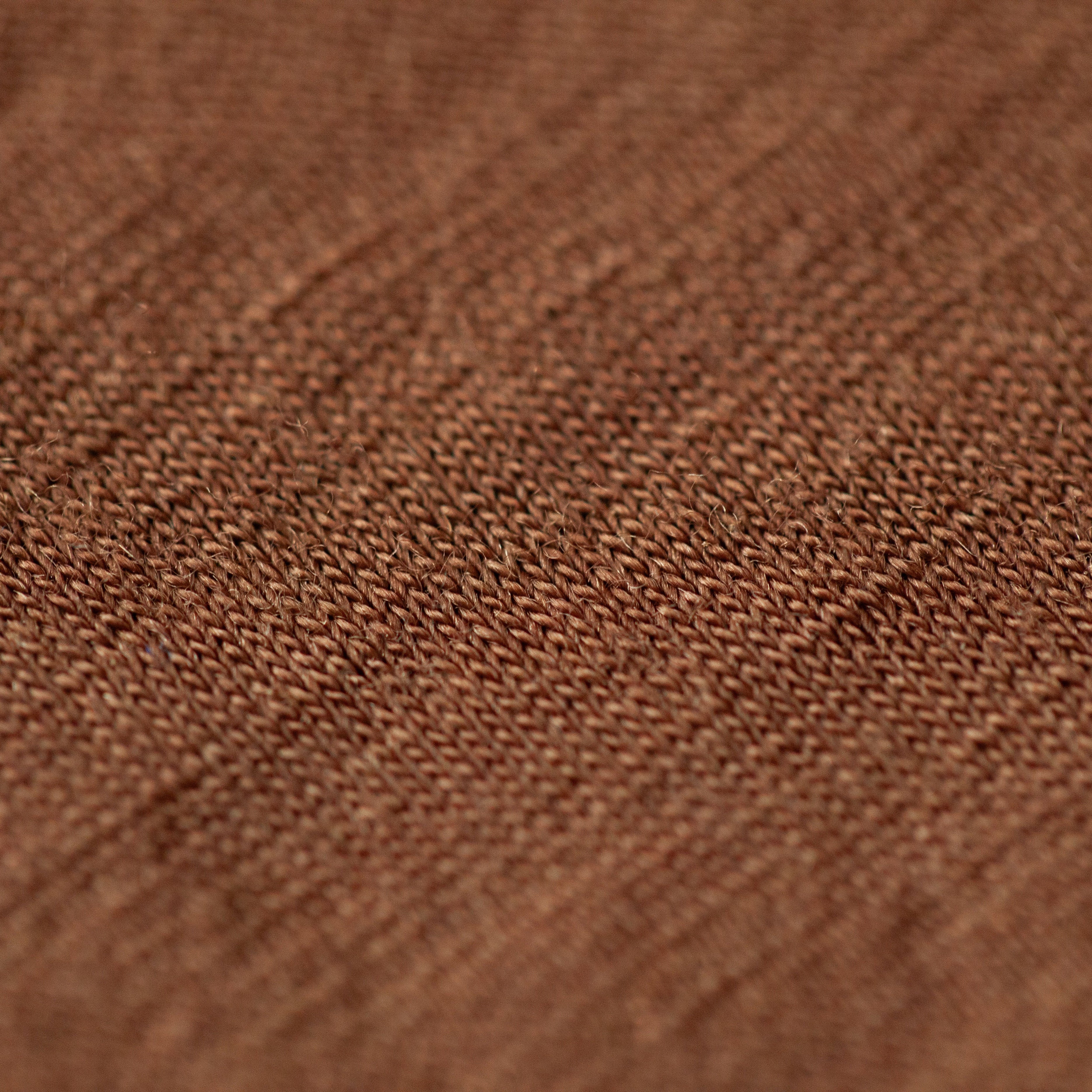 Close-up of the fine knit texture of Bark ultrafine Merino wool