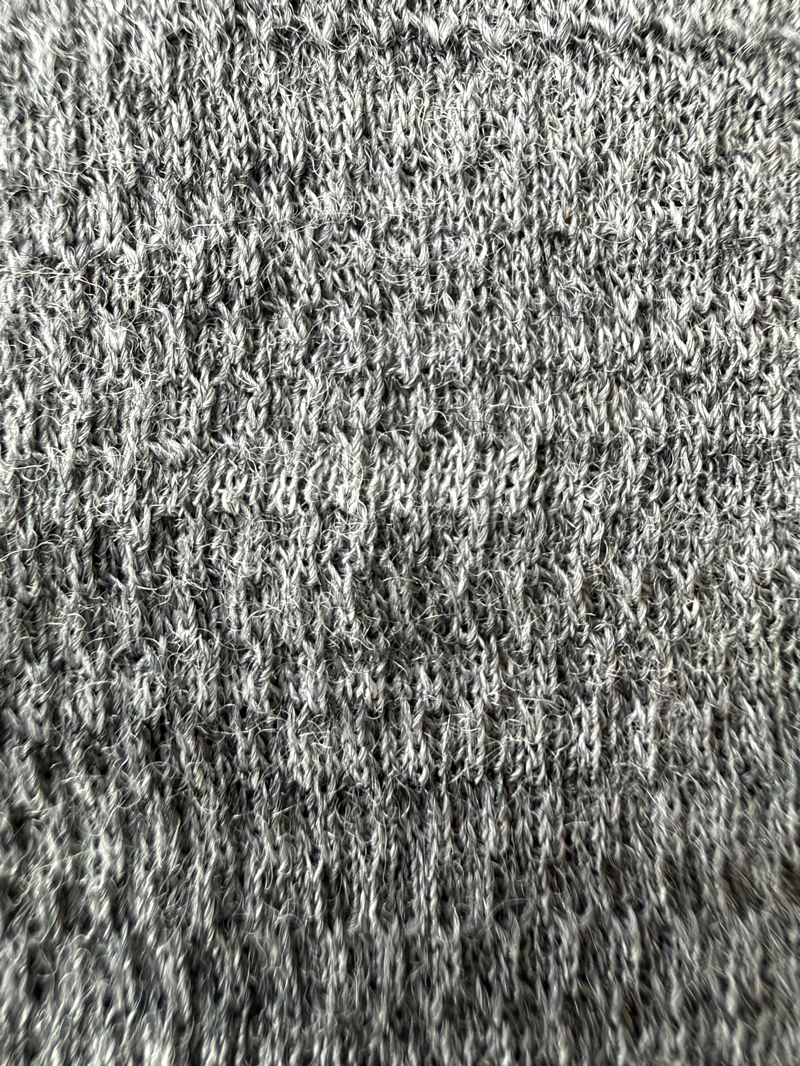 Macro view of the gray Merino mesh fabric used in the Glacial Gear x Zpacks Trail Rag